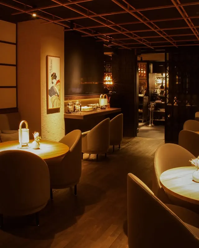 The Lounge, with armchairs and warm lamplight