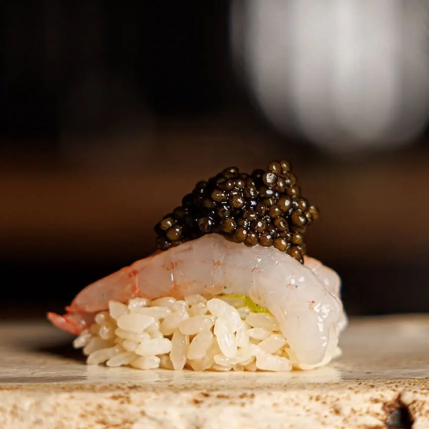 Prawn nigiri crowned with caviar