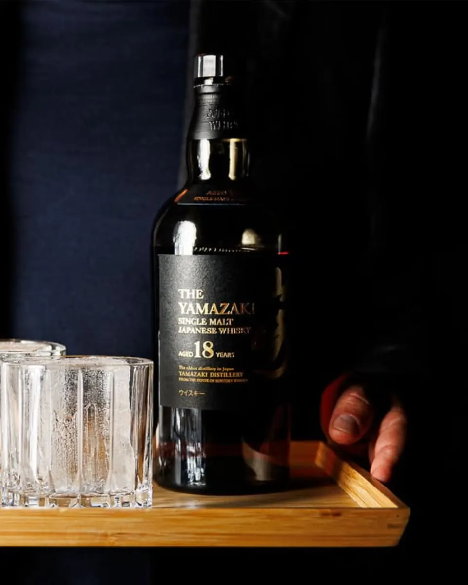 A bottle of Yamazaki 18 year old whisky served on a tray